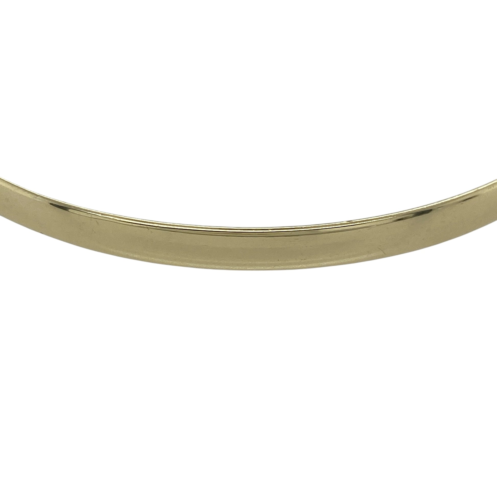 Add effortless elegance to your jewellery collection with this pre-owned 9ct yellow solid gold plain bangle, a timeless and versatile piece perfect for everyday wear or layering with other gold bracelets.

Design: This classic plain bangle features a smooth, polished finish with a 4mm width, offering a clean and understated look. The simple rounded profile gives it a refined appearance that complements both casual and formal outfits.