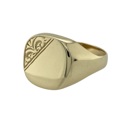 Make a confident statement with this pre-owned 9ct yellow gold patterned signet ring, a bold and traditional piece ideal for everyday wear or adding character to your jewellery collection.

Design: The ring features a striking signet face measuring approximately 14mm high, giving it strong presence on the finger. The patterned detailing across the front adds texture and visual interest, enhancing its classic signet profile with a distinctive finish.