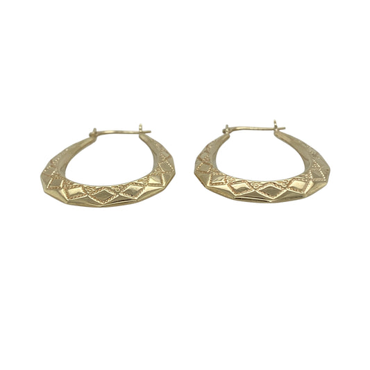 Add subtle texture to your jewellery collection with these pre-owned 9ct yellow gold patterned oval creole earrings, a timeless and versatile choice for everyday wear.

Design: These earrings feature a classic oval creole shape enhanced with delicate patterned detailing, creating a light-catching finish. The elongated oval profile offers a flattering silhouette while maintaining a refined and understated look.