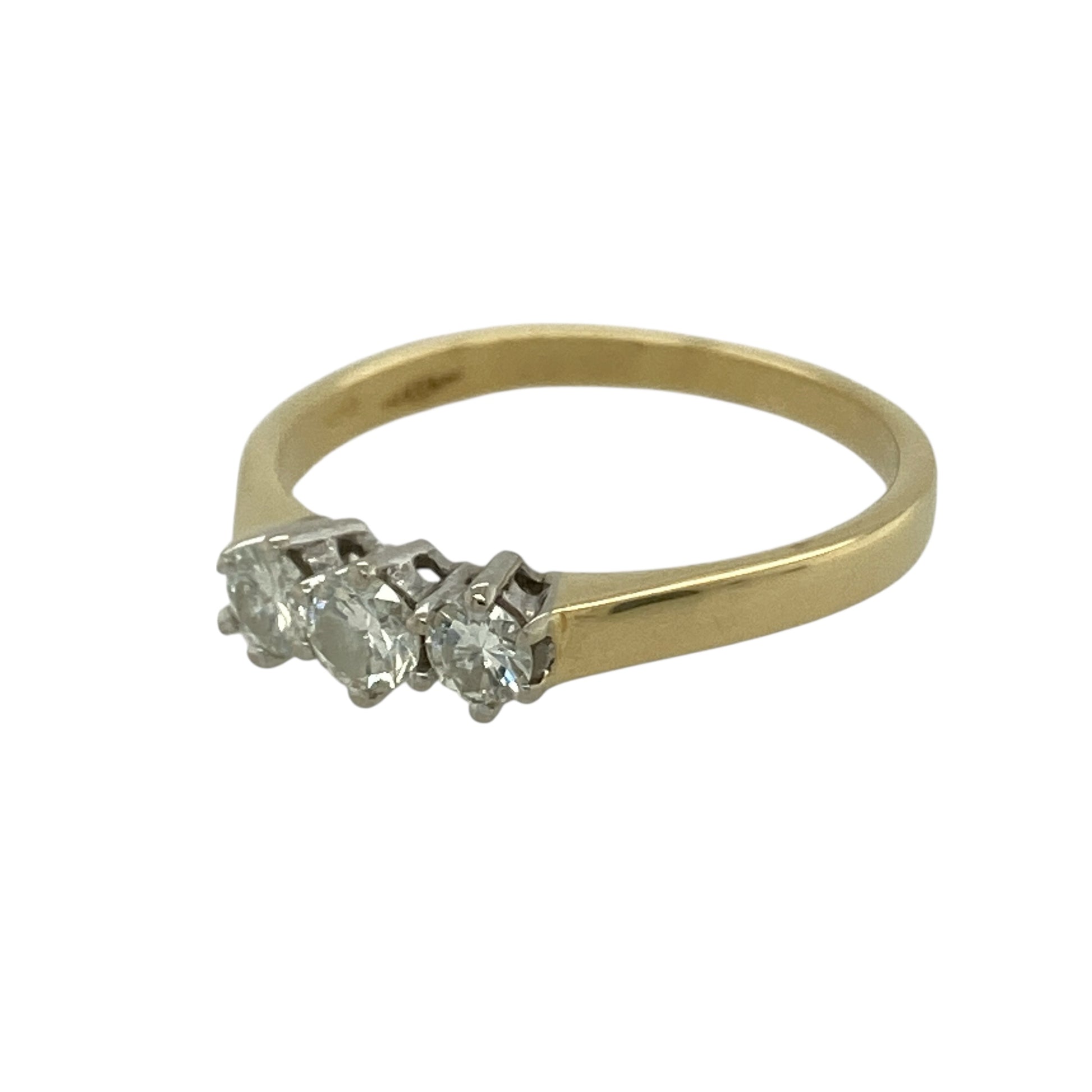 Celebrate timeless elegance with this pre-owned 18ct yellow gold diamond set trilogy ring, a classic and meaningful piece perfect for engagements, anniversaries or refined everyday wear.

Design: The ring features a traditional trilogy arrangement with three sparkling diamonds set across the centre, symbolising past, present and future. The balanced layout creates beautiful light reflection and a graceful, symmetrical profile on the finger.