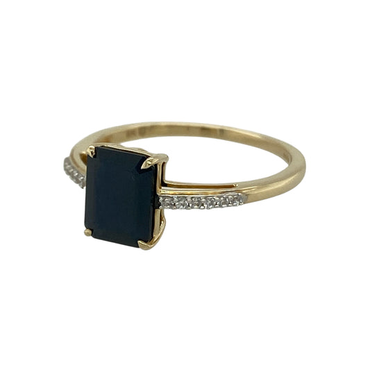 Add vibrant colour and sparkle to your jewellery collection with this pre-owned 9ct yellow gold sapphire and cubic zirconia set ring, a striking yet wearable piece ideal for everyday wear or special occasions.

Design: The ring features a bold rectangular sapphire measuring approximately 8mm by 6mm, creating a strong and elegant focal point. Sparkling cubic zirconia stones are set along the shoulders, enhancing the centre stone with added brilliance and balanced detail.