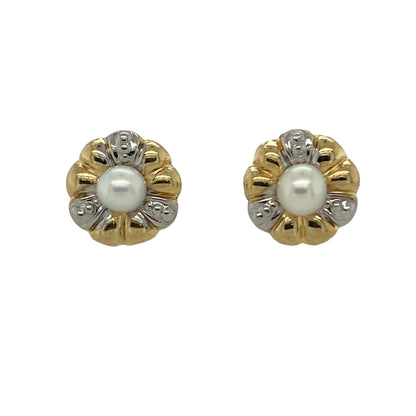 Add delicate elegance to your jewellery collection with these pre-owned 9ct yellow and white gold pearl set flower style stud earrings, a timeless and feminine pair perfect for everyday wear or special occasions.

Design: Each earring features a charming flower-inspired design centred with a lustrous pearl measuring approximately 4mm in diameter. The soft sheen of the pearls is beautifully framed by the surrounding gold detail, creating a classic and graceful look.