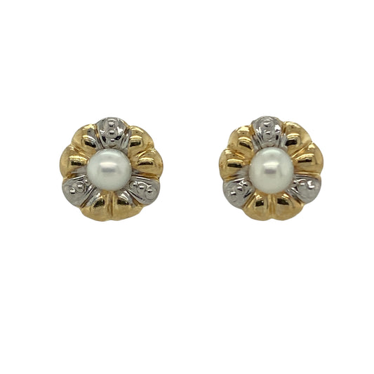 Add delicate elegance to your jewellery collection with these pre-owned 9ct yellow and white gold pearl set flower style stud earrings, a timeless and feminine pair perfect for everyday wear or special occasions.

Design: Each earring features a charming flower-inspired design centred with a lustrous pearl measuring approximately 4mm in diameter. The soft sheen of the pearls is beautifully framed by the surrounding gold detail, creating a classic and graceful look.