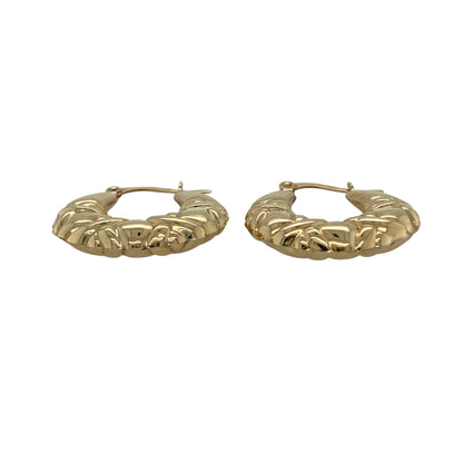 Add contemporary texture to your jewellery collection with these pre-owned 9ct yellow gold X shape patterned creole earrings, a stylish and versatile pair perfect for everyday wear.

Design: These earrings feature a classic creole hoop profile enhanced with an X shape patterned design, creating subtle texture and light reflection. The crossover detailing gives a modern twist to the traditional hoop style while maintaining a timeless look.