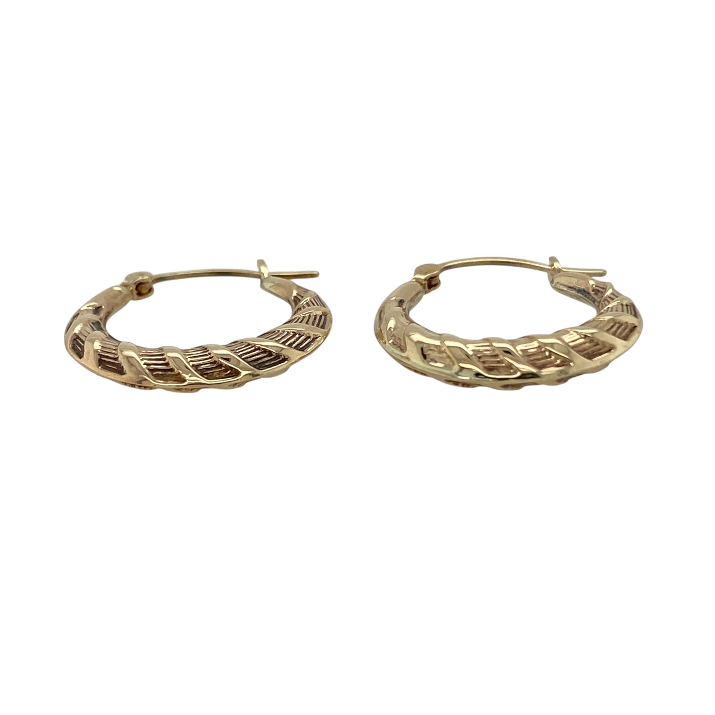 Add subtle texture to your jewellery collection with these pre-owned 9ct yellow gold twist patterned hoop creole earrings, a timeless and easy-to-wear pair perfect for everyday styling.

Design: These earrings feature a classic hoop creole shape enhanced with a delicate twist pattern, creating light-catching detail and added dimension. The gently sculpted profile offers a refined and feminine look while maintaining a traditional hoop silhouette.