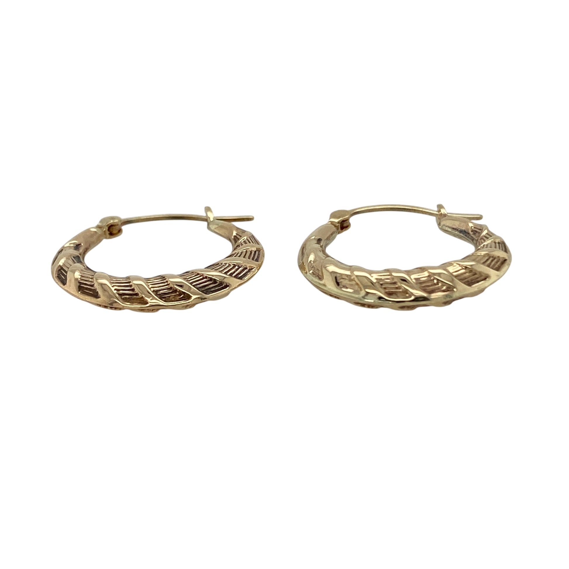 Add subtle texture to your jewellery collection with these pre-owned 9ct yellow gold twist patterned hoop creole earrings, a timeless and easy-to-wear pair perfect for everyday styling.

Design: These earrings feature a classic hoop creole shape enhanced with a delicate twist pattern, creating light-catching detail and added dimension. The gently sculpted profile offers a refined and feminine look while maintaining a traditional hoop silhouette.