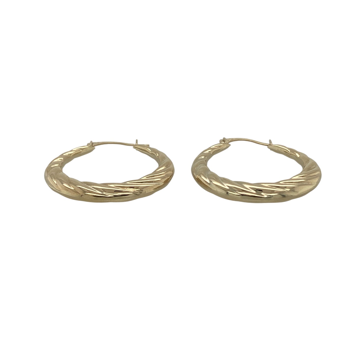 Add effortless elegance to your jewellery collection with these pre-owned 9ct yellow gold twisted hoop creole earrings, a lightweight and timeless pair perfect for everyday wear.

Design: These earrings feature a classic hoop creole silhouette with a subtle twisted design, creating gentle texture and light reflection. The flowing twist detail gives a refined and feminine touch while maintaining a simple, versatile style.