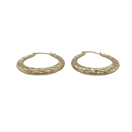 Add effortless elegance to your jewellery collection with these pre-owned 9ct yellow gold twisted hoop creole earrings, a lightweight and timeless pair perfect for everyday wear.

Design: These earrings feature a classic hoop creole silhouette with a subtle twisted design, creating gentle texture and light reflection. The flowing twist detail gives a refined and feminine touch while maintaining a simple, versatile style.