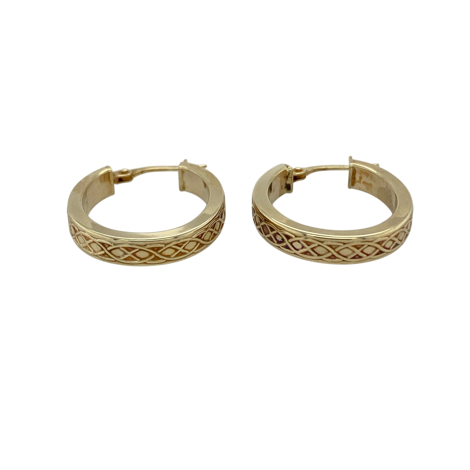 Add heritage-inspired detail to your jewellery collection with these pre-owned 9ct yellow gold Celtic weave oval creole earrings, a timeless and elegant pair perfect for everyday wear.

Design: These earrings feature an elongated oval creole shape enhanced with intricate Celtic weave detailing, symbolising eternity and connection. The woven pattern adds texture and depth, creating subtle light reflection while maintaining a refined profile.