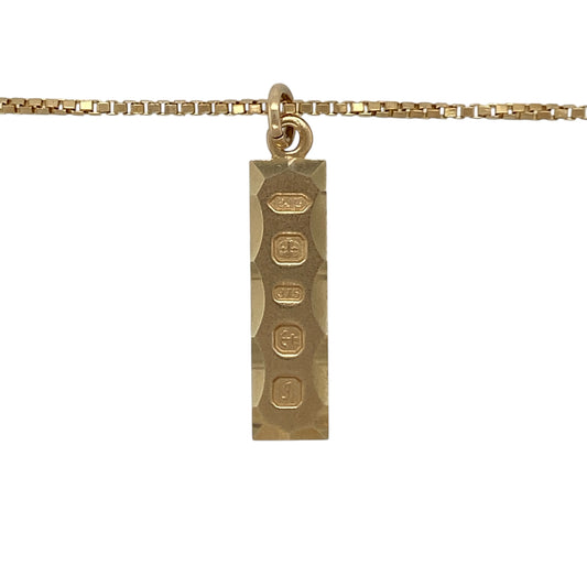 Make a classic statement with this pre-owned 9ct yellow gold ingot pendant on an 18" box chain necklace, a timeless and versatile piece perfect for everyday wear or gifting.

Design: The pendant features a traditional gold ingot design measuring approximately 3cm in length including the bail, offering a sleek and iconic profile. The smooth polished surface gives it a clean, bold appearance that never goes out of style.