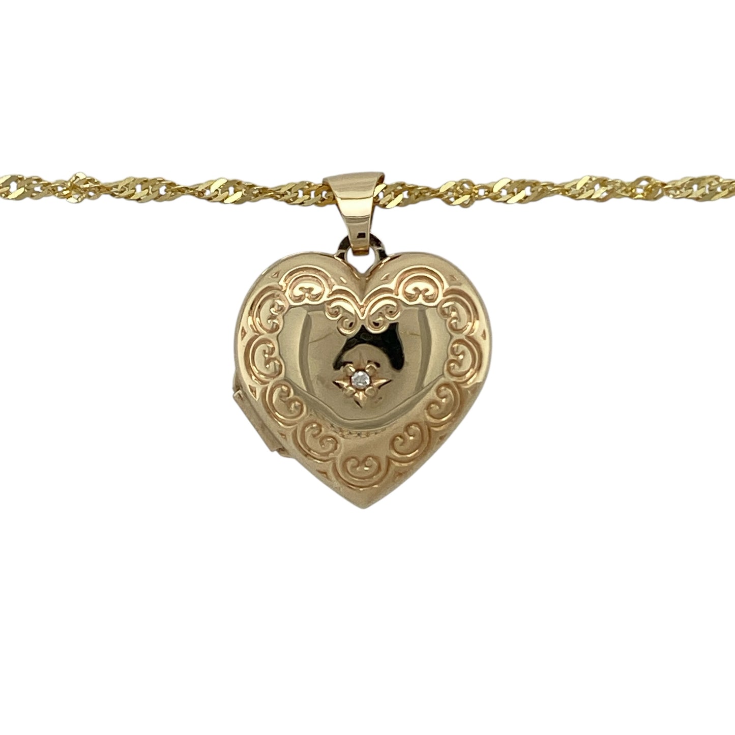 Celebrate timeless romance with this pre-owned 9ct yellow gold diamond set patterned heart locket pendant on an 18" Singapore chain necklace—an elegant and meaningful piece perfect for everyday wear or gifting.

Design: The heart-shaped locket features a beautifully patterned front with a delicate diamond accent, adding a subtle touch of sparkle to this classic design.