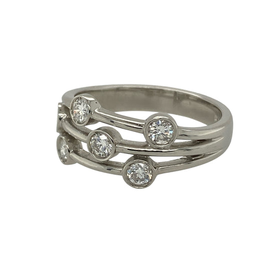 Make a bold and contemporary statement with this pre-owned platinum and diamond set split band bubble style ring—an eye-catching design perfect for special occasions or standout everyday wear.

Design: The front of the ring measures approximately 8mm wide and features a striking split band bubble style layout, creating a layered and dimensional look. The clustered arrangement of diamonds gives the illusion of larger stones while delivering impressive overall sparkle. 