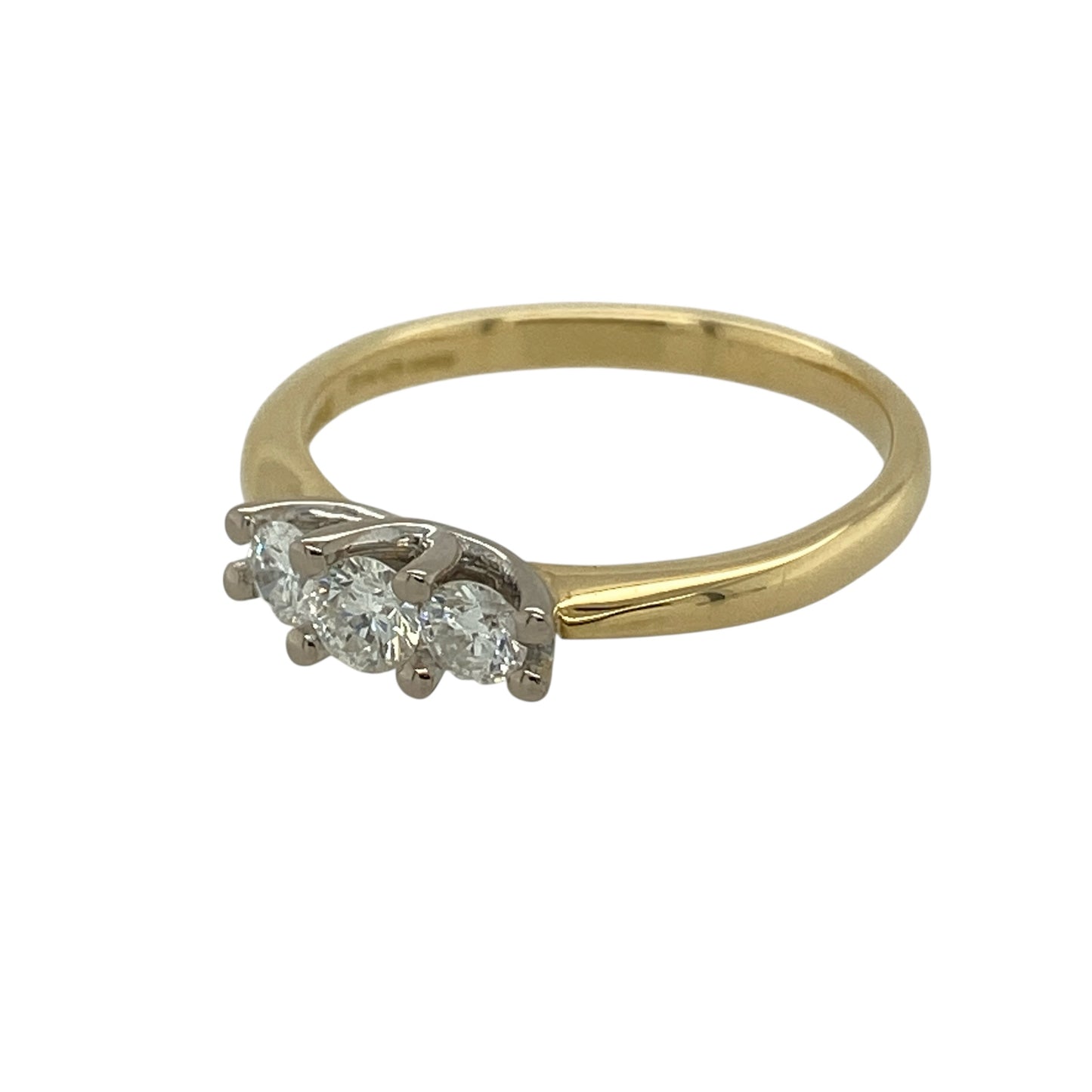 Celebrate timeless elegance with this pre-owned 18ct yellow gold diamond set trilogy ring—an exquisite design symbolising past, present and future, perfect for engagements, anniversaries or meaningful gifting.

Design: The ring features three beautifully matched diamonds arranged in a classic trilogy formation, offering balanced sparkle and refined brilliance across the finger. The traditional layout creates a sophisticated silhouette with enduring appeal.