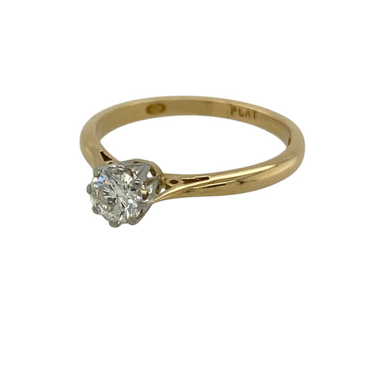 Discover timeless elegance with this pre-owned 18ct yellow gold and platinum diamond set solitaire ring—an enduring design perfect for engagements, anniversaries or refined everyday wear.

Design: The ring showcases a sparkling brilliant cut diamond weighing approximately 0.35ct, beautifully presented in a classic solitaire setting that allows maximum light to enhance its natural fire and brilliance. The clean, traditional silhouette ensures the centre stone remains the focal point.