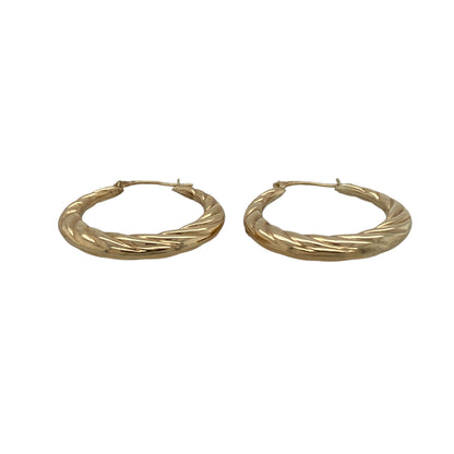 Add subtle texture and timeless style to your jewellery collection with these pre-owned 9ct yellow gold twisted hoop creole earrings—an elegant choice for everyday wear.

Design: The classic hoop creole silhouette is enhanced with a delicate twisted finish, creating gentle light reflection and added dimension. The twist detail gives the earrings a refined update while maintaining a simple and wearable profile.
