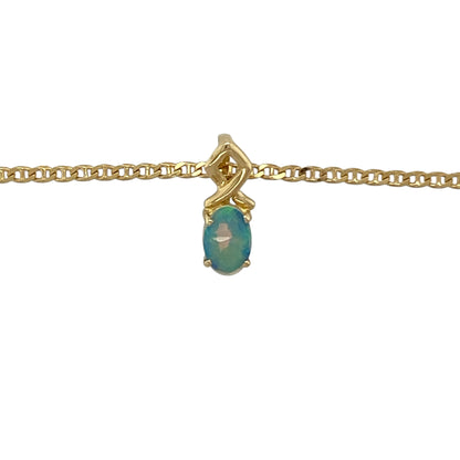 Add a soft shimmer of colour to your jewellery collection with this pre-owned 18ct yellow gold opalique style pendant on a 16" anchor chain necklace—an elegant piece perfect for everyday wear or subtle occasion styling.

Design: The pendant measures approximately 1.2cm long including the bail and features a beautiful oval opalique style stone measuring around 6mm by 4mm. The stone displays a gentle iridescent glow, creating a delicate and eye-catching focal point.