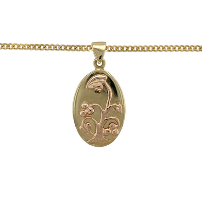 Celebrate Welsh heritage and meaningful symbolism with this pre-owned 9ct yellow and rose gold Cymru metal Tree of Life oval pendant on a 20" curb chain necklace—an elegant and distinctive piece with timeless appeal.

Design: The oval pendant measures approximately 2.9cm long including the bail and features the iconic Tree of Life motif, symbolising growth, strength and family. The rose gold Tree of Life design contrasts beautifully against the yellow gold oval frame, creating depth and eye-catching detail.