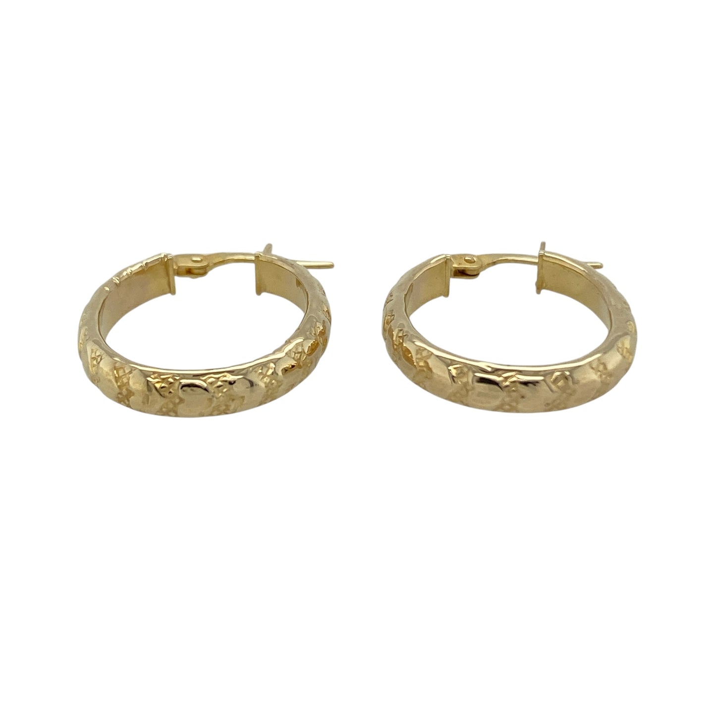 Add romantic detail to your jewellery collection with these pre-owned 9ct yellow gold heart patterned oval creole earrings—an elegant and feminine choice perfect for everyday wear.

Design: The oval creole silhouette is enhanced with delicate heart patterned detailing, adding texture and subtle charm to the classic hoop style. The decorative finish catches the light beautifully, giving the earrings a refined yet eye-catching look.