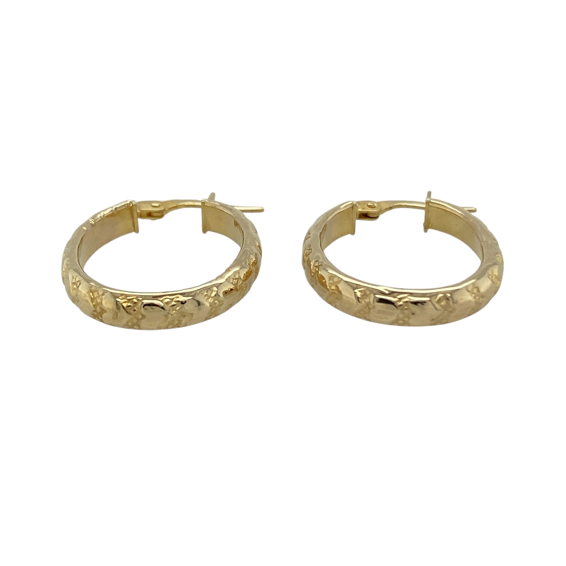 Add romantic detail to your jewellery collection with these pre-owned 9ct yellow gold heart patterned oval creole earrings—an elegant and feminine choice perfect for everyday wear.

Design: The oval creole silhouette is enhanced with delicate heart patterned detailing, adding texture and subtle charm to the classic hoop style. The decorative finish catches the light beautifully, giving the earrings a refined yet eye-catching look.
