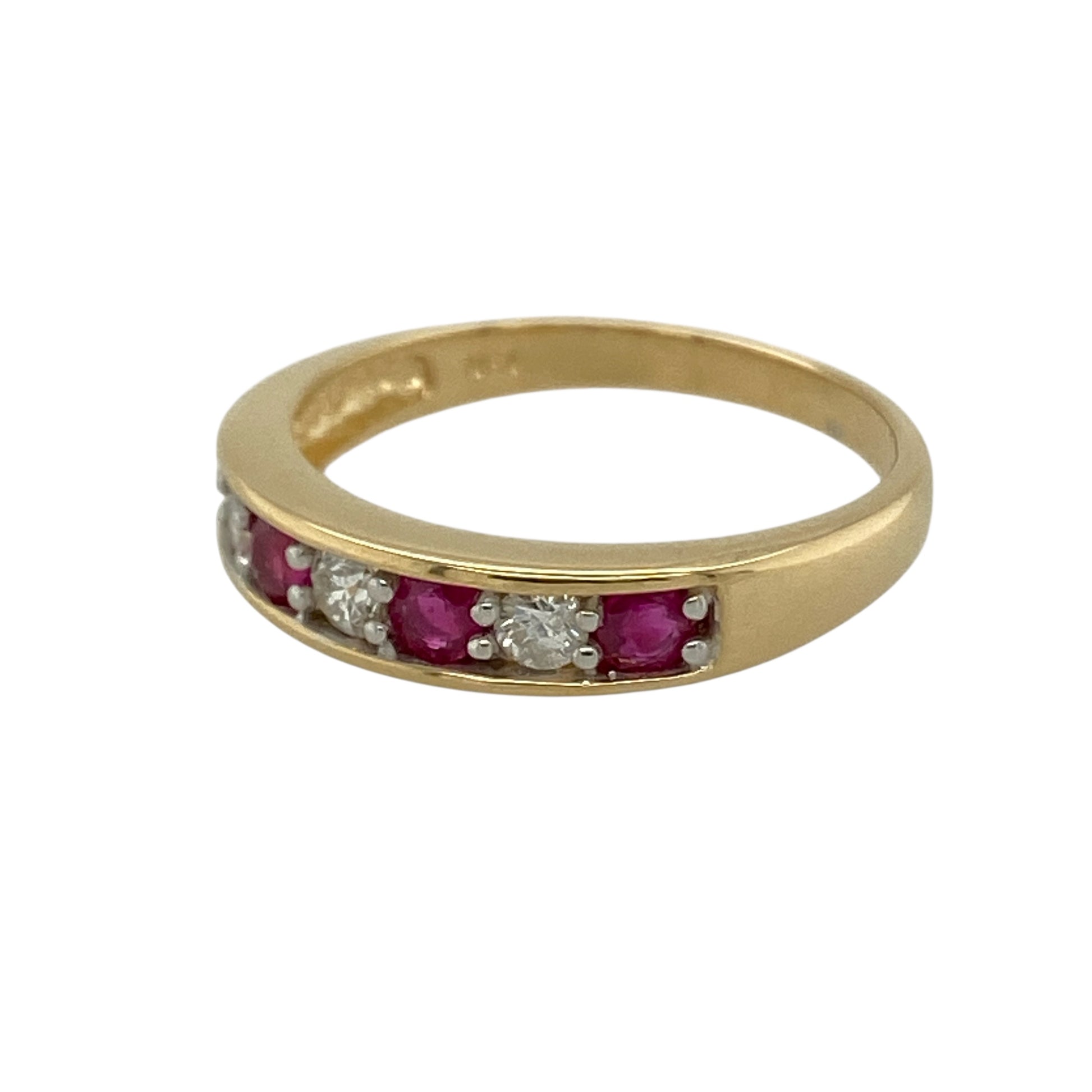 Add vibrant colour and timeless sparkle to your jewellery collection with this pre-owned 18ct yellow gold diamond and ruby set band ring, combining rich gemstones with classic gold styling—perfect as an anniversary ring or elegant statement band.

Design: The front of the band measures approximately 4mm wide and features a striking combination of diamonds and rubies arranged across the centre.