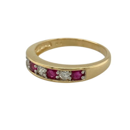 Add vibrant colour and timeless sparkle to your jewellery collection with this pre-owned 18ct yellow gold diamond and ruby set band ring, combining rich gemstones with classic gold styling—perfect as an anniversary ring or elegant statement band.

Design: The front of the band measures approximately 4mm wide and features a striking combination of diamonds and rubies arranged across the centre.