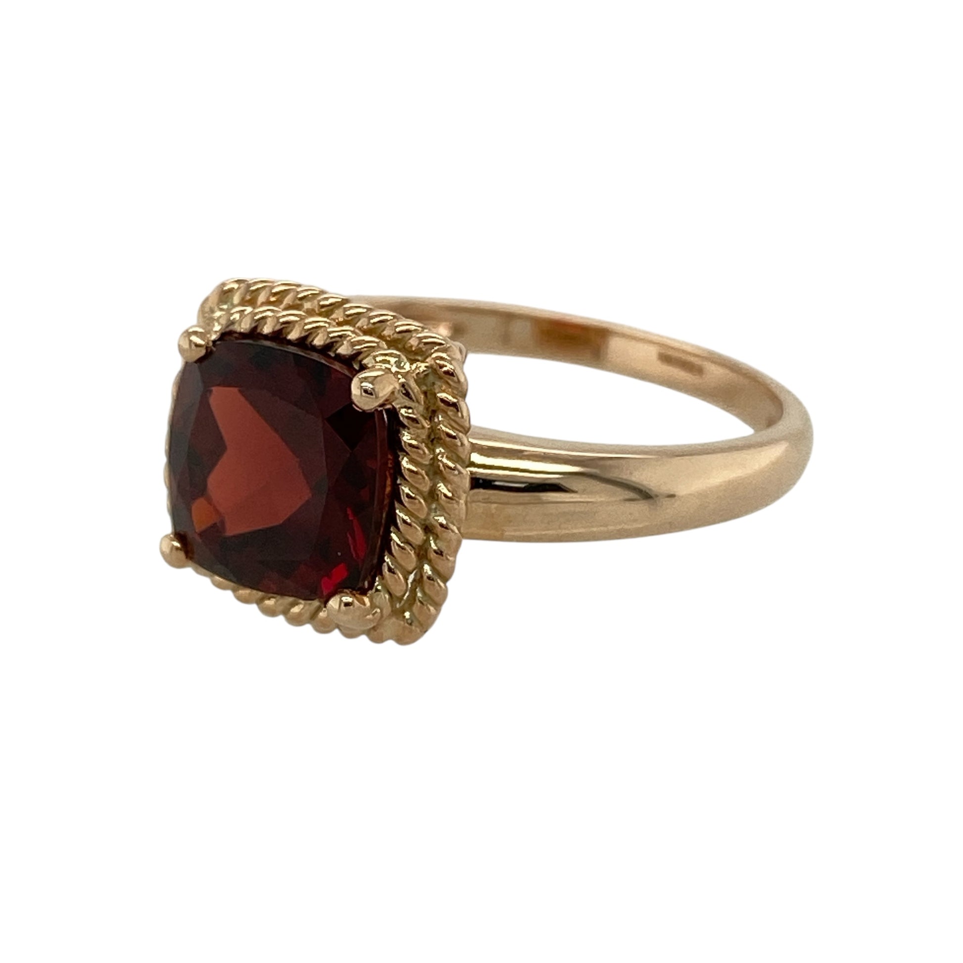 Add rich colour and timeless elegance to your jewellery collection with this pre-owned 9ct rose gold garnet solitaire ring, featuring a striking gemstone and warm gold tones—perfect as a statement dress ring or meaningful birthstone piece.

Design: The ring showcases a beautiful cushion cut garnet at the centre measuring approximately 8mm by 8mm. The deep red gemstone creates a bold focal point, while the classic solitaire style allows the garnet’s colour and brilliance to stand out.