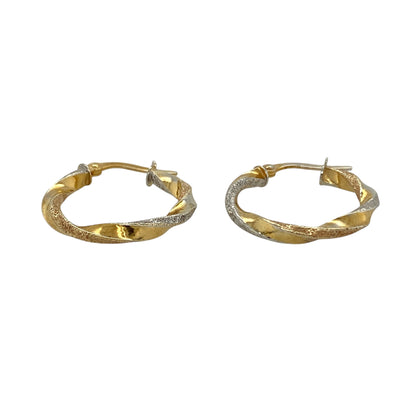 Add subtle sparkle and elegant contrast to your jewellery collection with these pre-owned 9ct yellow and white gold twisted sparkle hoop creole earrings, featuring a classic two-tone design—perfect for everyday wear.

Design: The earrings feature a traditional hoop creole shape with a twisted design that combines yellow and white gold. The textured sparkle finish catches the light beautifully, creating a delicate shimmer as the earrings move.