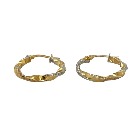 Add subtle sparkle and elegant contrast to your jewellery collection with these pre-owned 9ct yellow and white gold twisted sparkle hoop creole earrings, featuring a classic two-tone design—perfect for everyday wear.

Design: The earrings feature a traditional hoop creole shape with a twisted design that combines yellow and white gold. The textured sparkle finish catches the light beautifully, creating a delicate shimmer as the earrings move.