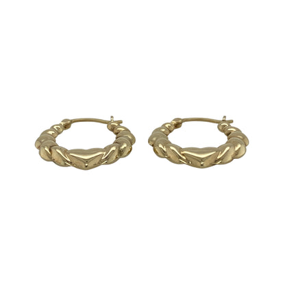 Add playful charm and timeless gold style to your jewellery collection with these pre-owned 9ct yellow gold heart bubble style oval creole earrings, featuring a distinctive textured design—perfect for everyday wear.

Design: The earrings feature an elegant oval creole shape decorated with raised heart bubble detailing across the surface. The textured pattern adds dimension and light-catching shine while giving the earrings a fun and feminine look.
