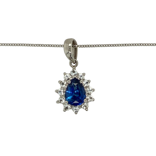 Add elegant colour and refined sparkle to your jewellery collection with this pre-owned 18ct white gold sapphire and white topaz teardrop cluster pendant necklace, featuring a graceful and timeless design—perfect for both everyday wear and special occasions.

Design: The pendant features a beautiful teardrop-shaped cluster design set with deep blue sapphires and sparkling white topaz. The elegant drop silhouette enhances the contrast between the gemstones, creating a striking and sophisticated focal point. 