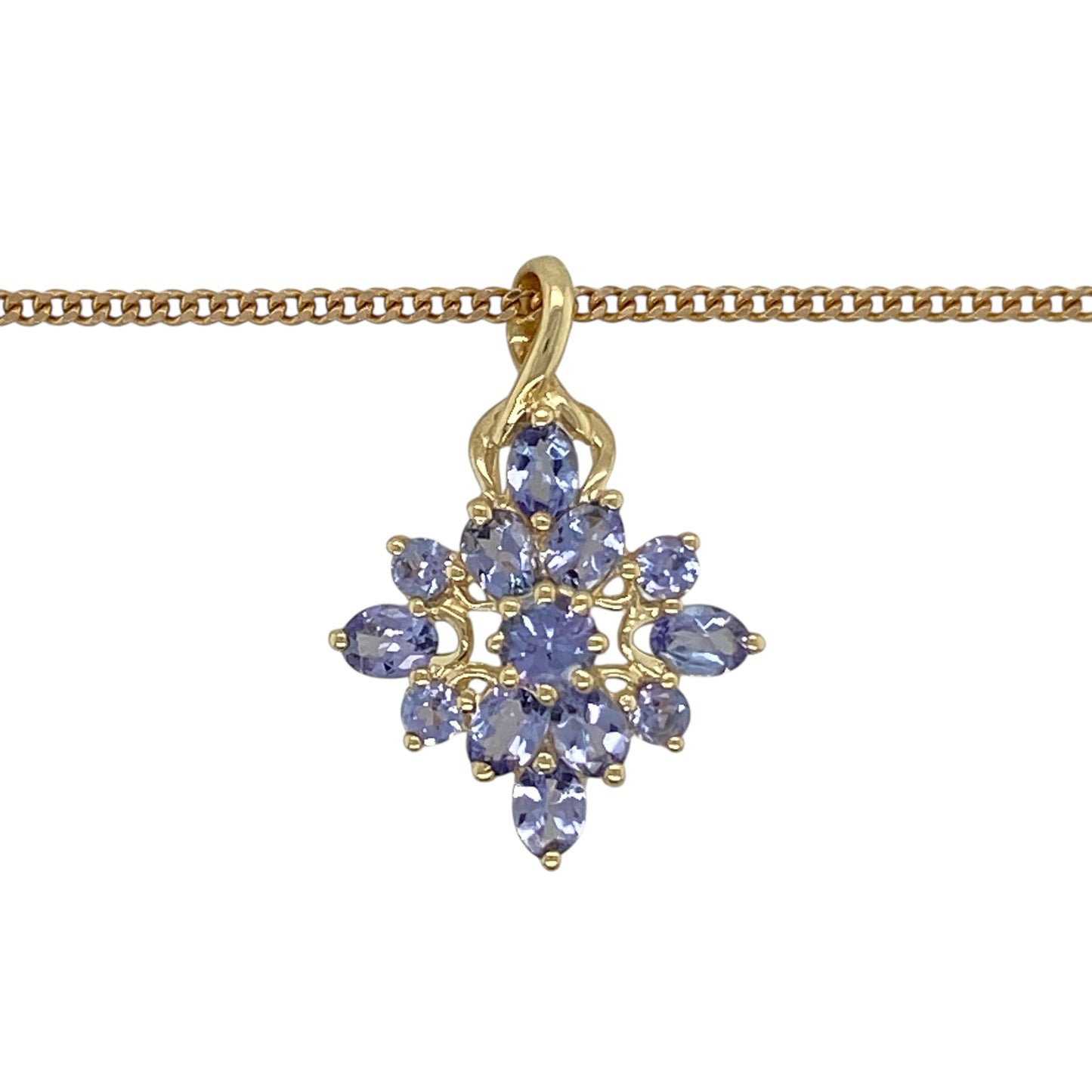 Add vibrant colour and elegant sparkle to your jewellery collection with this pre-owned 9ct yellow gold tanzanite cluster pendant necklace, featuring a striking gemstone arrangement—perfect for special occasions or everyday elegance.

Design: The pendant showcases a beautiful cluster of tanzanite stones arranged to create a rich display of violet-blue colour and brilliance. Measuring approximately 2.5cm in length including the bail, the pendant offers a noticeable yet elegant presence.