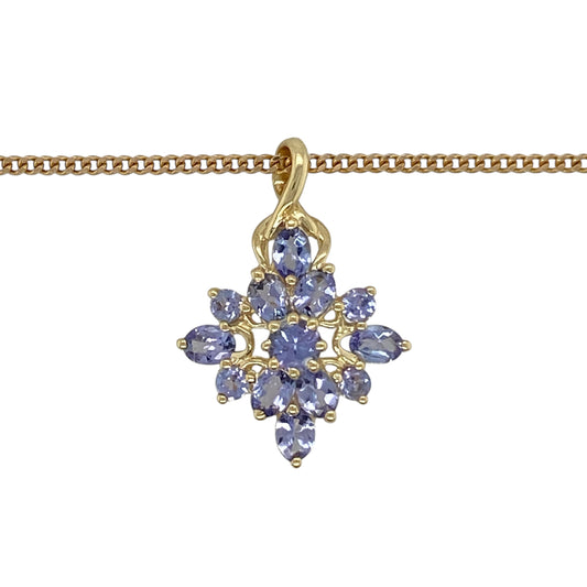 Add vibrant colour and elegant sparkle to your jewellery collection with this pre-owned 9ct yellow gold tanzanite cluster pendant necklace, featuring a striking gemstone arrangement—perfect for special occasions or everyday elegance.

Design: The pendant showcases a beautiful cluster of tanzanite stones arranged to create a rich display of violet-blue colour and brilliance. Measuring approximately 2.5cm in length including the bail, the pendant offers a noticeable yet elegant presence.