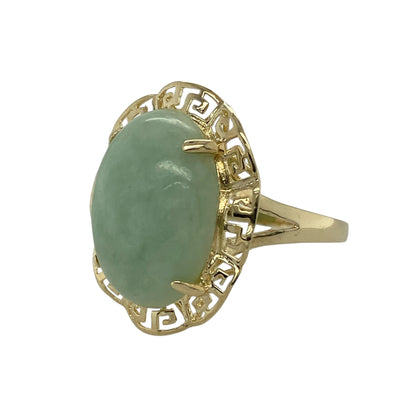 Add bold vintage-inspired style to your jewellery collection with this pre-owned 9ct yellow gold jade Greek key ring, featuring a striking gemstone and decorative surround—perfect as a statement piece or distinctive dress ring.

Design: The ring showcases a large oval jade measuring approximately 17mm by 13mm, creating a strong and eye-catching focal point. The gemstone is framed by an intricate Greek key style surround, adding a classic decorative border that enhances the overall design.