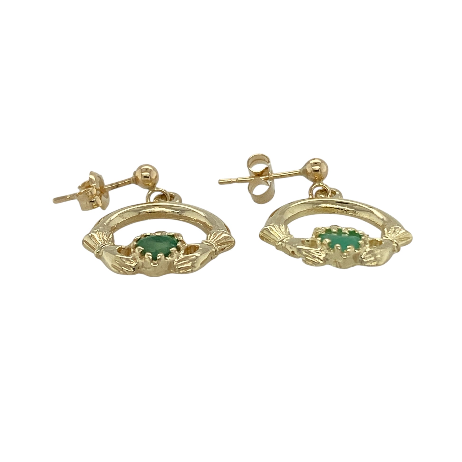 Add meaningful symbolism and elegant colour to your jewellery collection with these pre-owned 9ct yellow gold green stone Claddagh drop earrings, featuring the iconic Irish design—perfect as a thoughtful gift or everyday jewellery piece.

Design: Each earring is styled in the traditional Claddagh motif, featuring hands holding a heart topped with a crown. The heart is formed by a green stone measuring approximately 4.5mm, adding vibrant colour while maintaining the classic symbolic design.