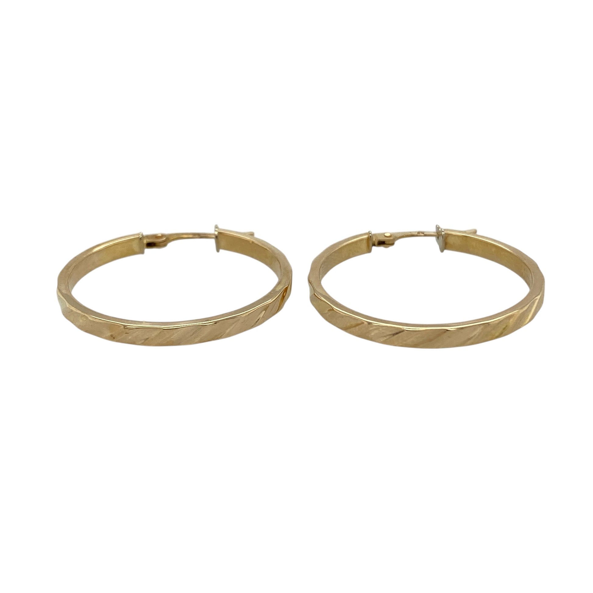Add classic texture and timeless style to your jewellery collection with these pre-owned 9ct yellow gold stripe patterned hoop creole earrings, featuring a decorative finish—perfect for everyday wear or special occasions.

Design: The earrings feature a traditional hoop creole shape with fine striped detailing across the surface, creating a subtle textured effect that catches the light beautifully.