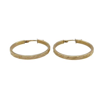 Add classic texture and timeless style to your jewellery collection with these pre-owned 9ct yellow gold stripe patterned hoop creole earrings, featuring a decorative finish—perfect for everyday wear or special occasions.

Design: The earrings feature a traditional hoop creole shape with fine striped detailing across the surface, creating a subtle textured effect that catches the light beautifully.