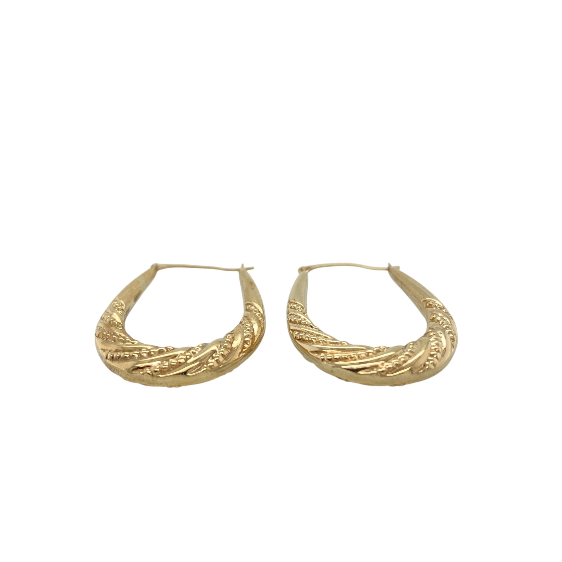 Add classic texture and timeless style to your jewellery collection with these pre-owned 9ct yellow gold patterned oval creole earrings, featuring decorative detailing and elegant gold styling—perfect for everyday wear or special occasions.

Design: The earrings feature a traditional oval creole hoop shape with patterned detailing across the surface, creating a subtle textured finish that catches the light beautifully.