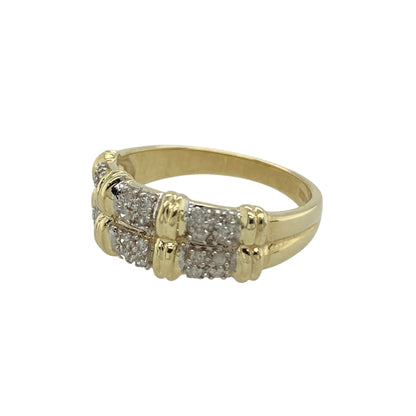 Add contemporary sparkle and elegant styling to your jewellery collection with this pre-owned 9ct yellow gold diamond double band ring, featuring a modern layered design—perfect for everyday wear or as a stylish statement piece.

Design: The ring features a double band style across the front, creating a layered look that adds depth and visual interest. Sparkling diamond accents enhance the design, adding refined brilliance and subtle shimmer.
