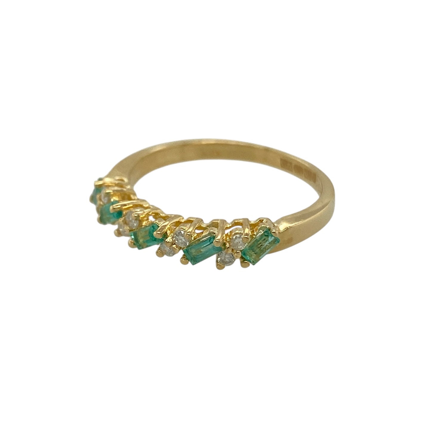 Add vibrant colour and elegant sparkle to your jewellery collection with this pre-owned 18ct yellow gold diamond and emerald coloured stone band ring, featuring a timeless gemstone combination—perfect for everyday wear or a stylish statement piece.

Design: The band showcases a beautiful arrangement of emerald coloured stones complemented by sparkling diamond accents across the front, creating a balanced display of rich green colour and brilliant sparkle.
