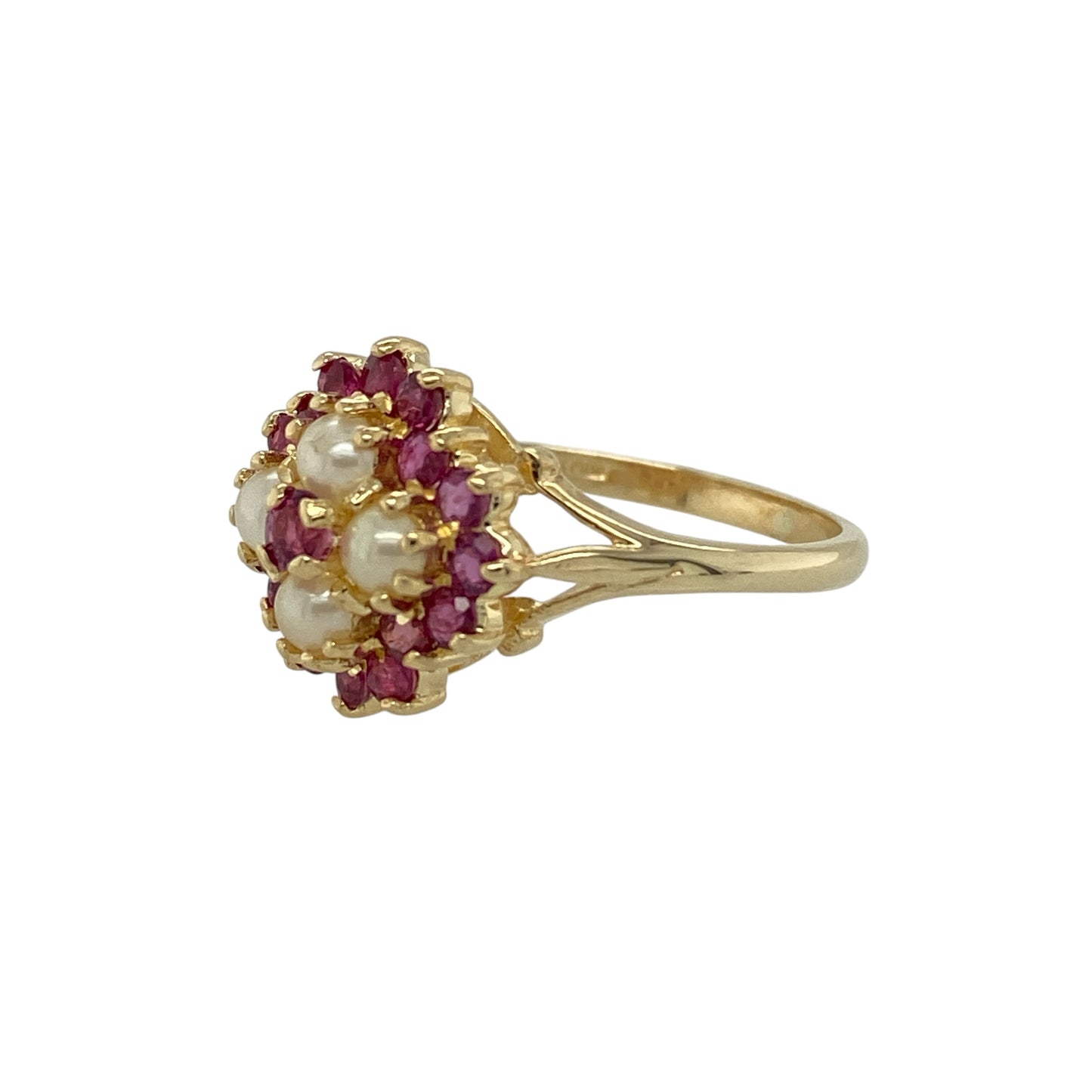Add delicate vintage-inspired charm to your jewellery collection with this pre-owned 9ct yellow gold ruby and pearl flower ring, featuring a classic floral design—perfect for everyday wear or as a thoughtful gift.

Design: The ring showcases a beautiful flower motif formed from rich red rubies and lustrous pearls, creating a striking contrast of colour and texture. The floral cluster design gives the ring a soft and elegant appearance.
