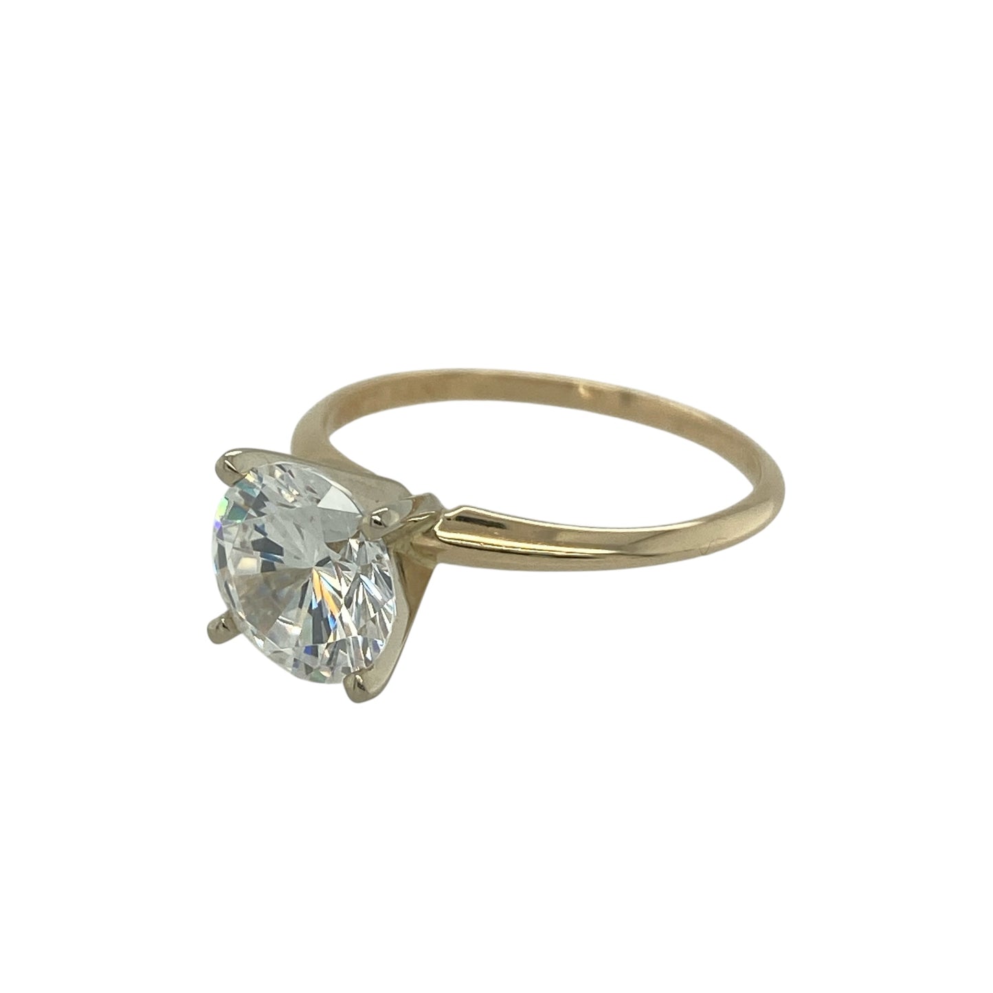 Add classic sparkle and timeless elegance to your jewellery collection with this pre-owned 14ct yellow gold cubic zirconia solitaire ring, featuring a bold and eye-catching centre stone—perfect for everyday wear or a stylish statement piece.

Design: The ring showcases a round cubic zirconia at the centre measuring approximately 8mm, creating a bright and striking focal point with excellent light reflection. The solitaire style allows the stone to stand out beautifully.
