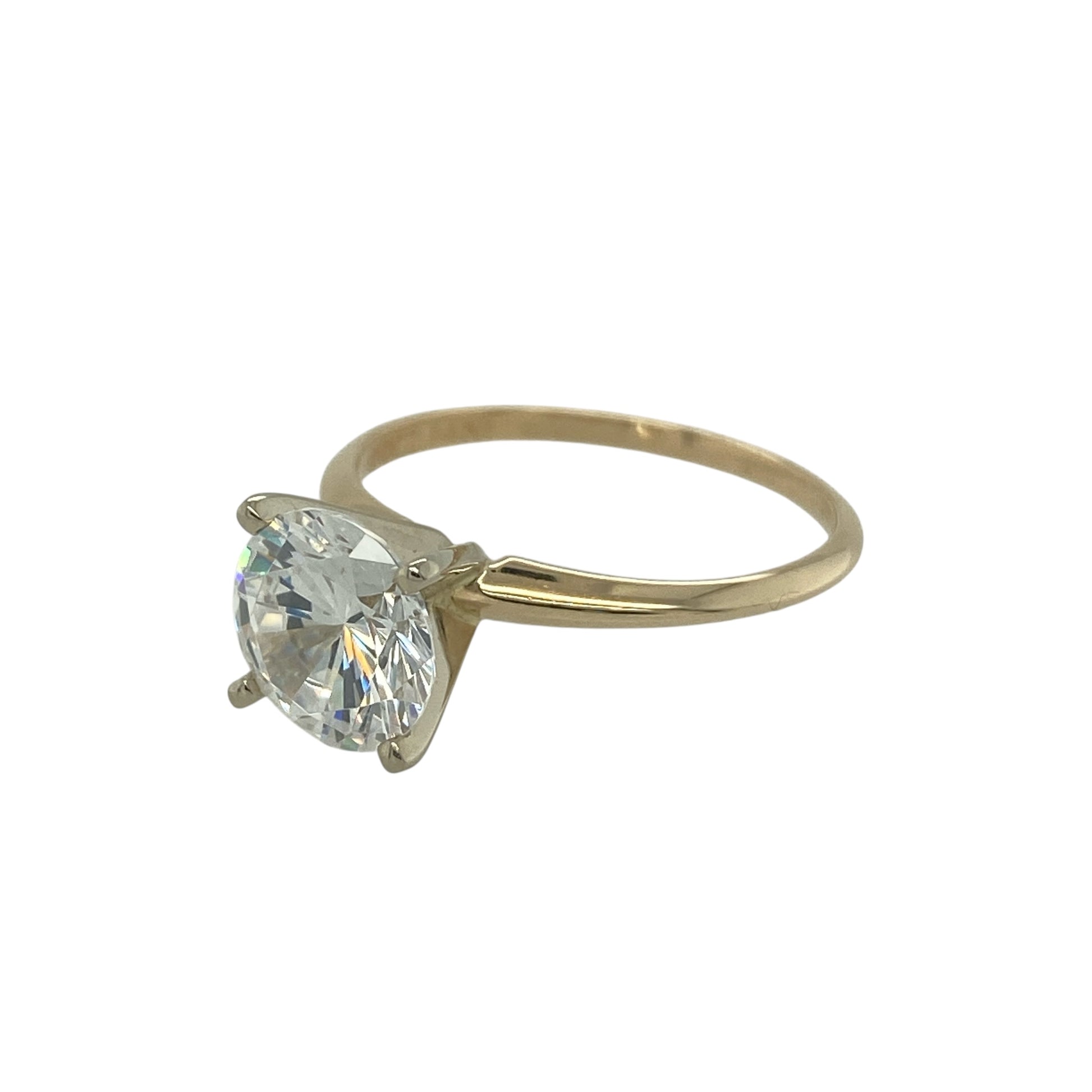 Add classic sparkle and timeless elegance to your jewellery collection with this pre-owned 14ct yellow gold cubic zirconia solitaire ring, featuring a bold and eye-catching centre stone—perfect for everyday wear or a stylish statement piece.

Design: The ring showcases a round cubic zirconia at the centre measuring approximately 8mm, creating a bright and striking focal point with excellent light reflection. The solitaire style allows the stone to stand out beautifully.
