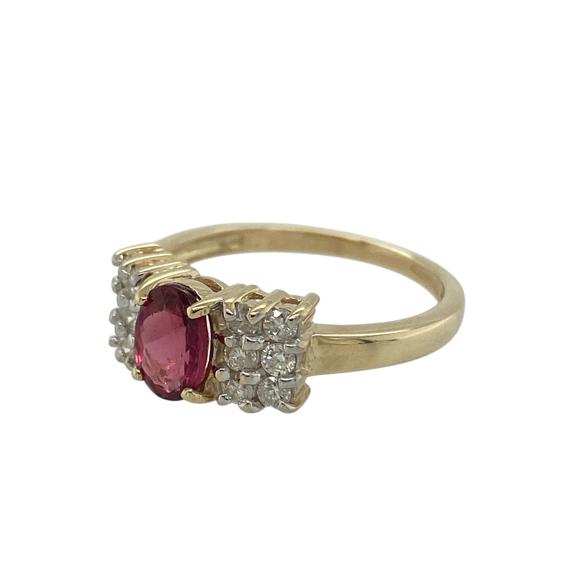 Add vibrant colour and elegant sparkle to your jewellery collection with this pre-owned 9ct yellow gold diamond and ruby coloured stone ring, featuring a striking gemstone and sparkling diamond detail—perfect as a statement dress ring or eye-catching everyday piece.

Design: The ring showcases an oval ruby coloured centre stone measuring approximately 7mm by 5mm, creating a bold focal point. 
