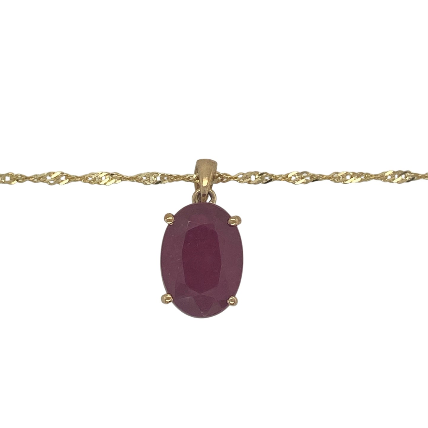 Add rich colour and timeless elegance to your jewellery collection with this pre-owned 9ct yellow gold ruby oval pendant necklace, featuring a striking gemstone—perfect for special occasions or a standout everyday piece.

Design: The necklace showcases a large oval ruby measuring approximately 14mm by 10mm, creating a bold and eye-catching focal point with deep red colour and classic appeal.
