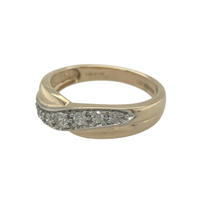 Add elegant sparkle and contemporary style to your jewellery collection with this pre-owned 9ct yellow gold diamond crossover band ring, featuring a striking and eye-catching design—perfect for everyday wear or a statement dress ring.

Design: The ring features a graceful crossover band design set with sparkling diamonds, creating a flowing and dynamic look across the finger. With approximately 0.25ct total diamond content, the stones offer beautiful brilliance and light reflection.
