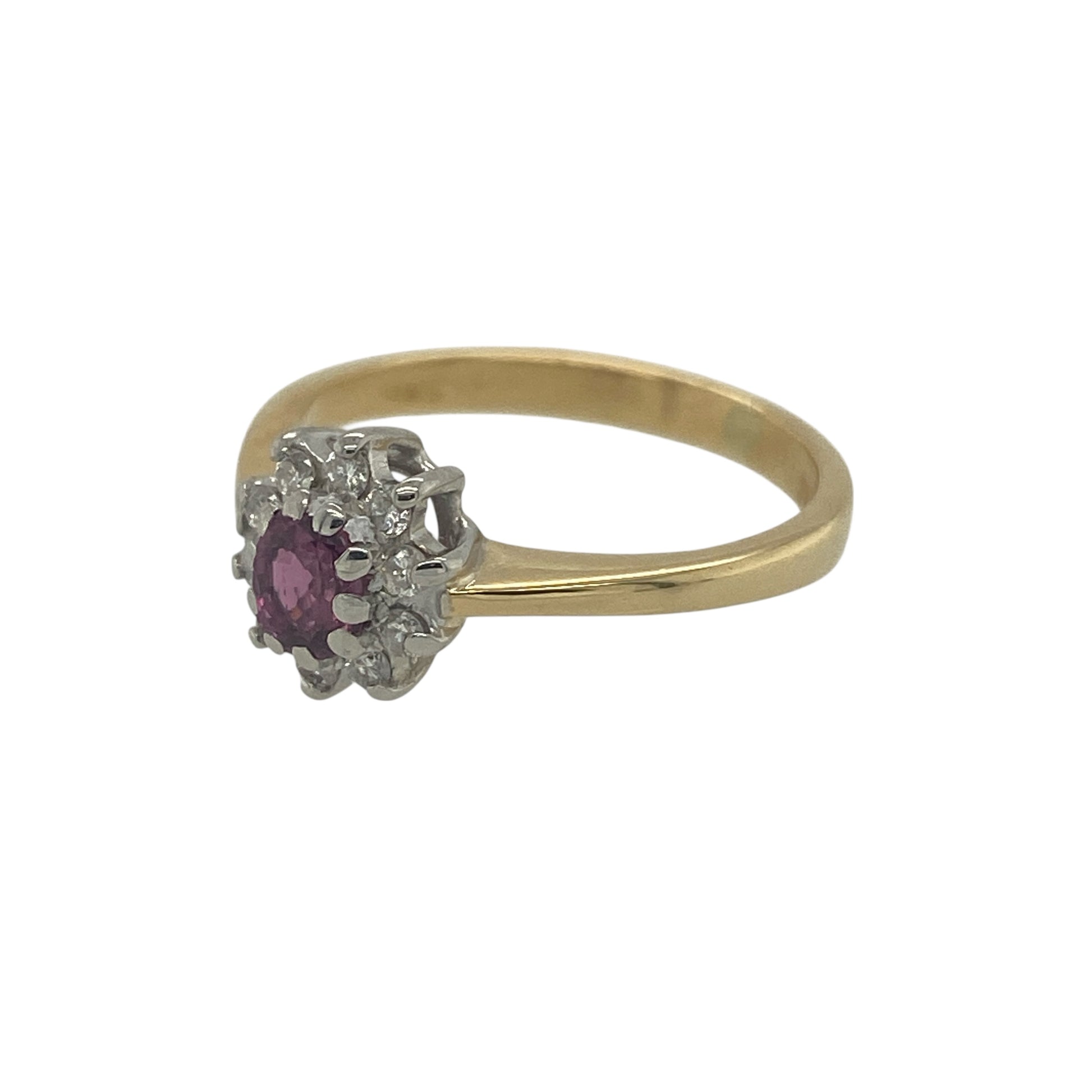 Add rich colour and timeless sparkle to your jewellery collection with this pre-owned 18ct yellow gold diamond and ruby cluster ring, featuring a classic gemstone combination—perfect for everyday elegance or a meaningful gift.

Design: The ring showcases an oval ruby at the centre measuring approximately 4mm by 3mm, surrounded by a cluster of sparkling diamonds that enhance the deep red colour and create a bright, eye-catching focal point.
