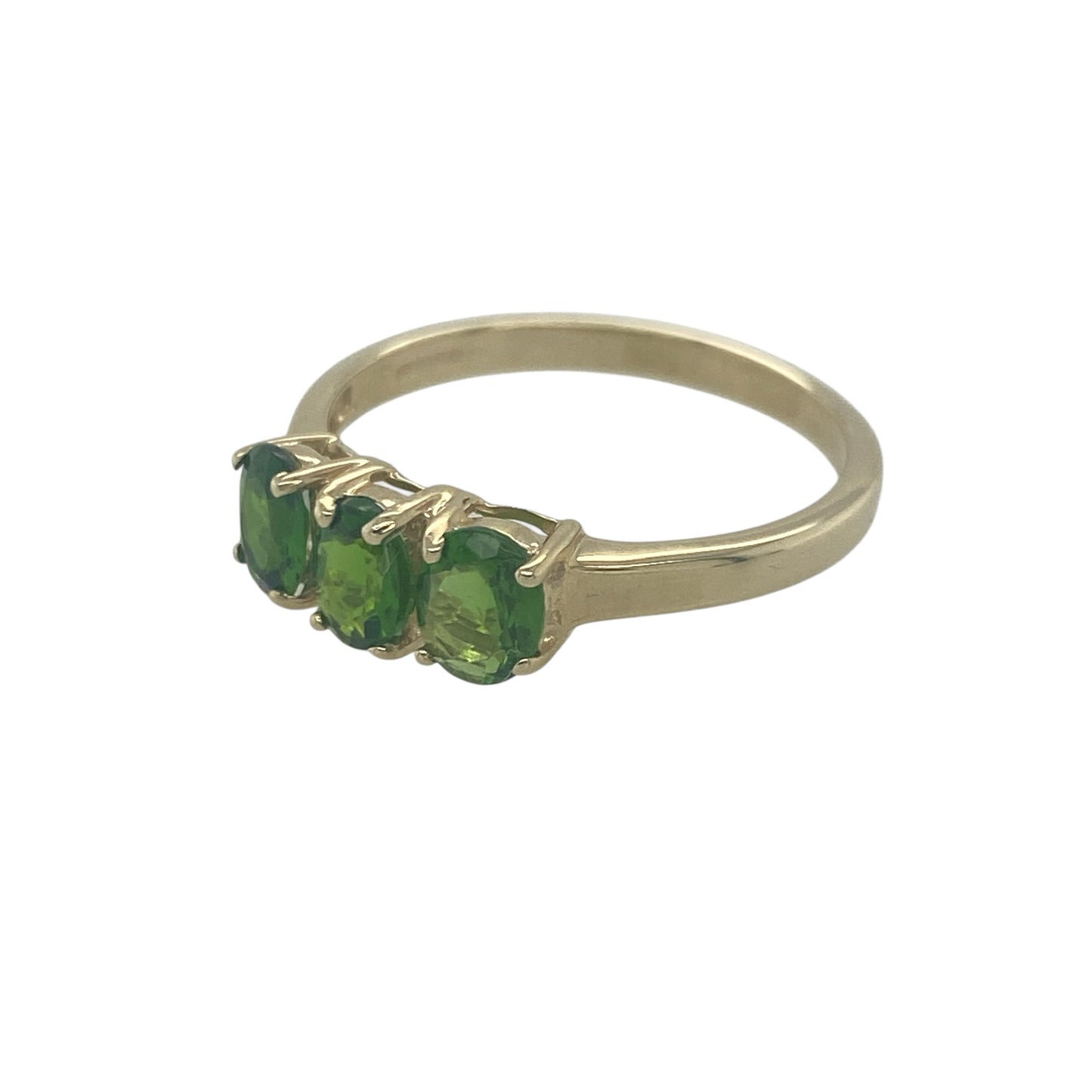 Add classic colour and timeless elegance to your jewellery collection with this pre-owned 9ct yellow gold green stone trilogy ring, featuring a traditional three-stone design with rich green tones—perfect for everyday wear or meaningful gifting.

Design: The ring showcases a trilogy arrangement of green gemstones, each measuring approximately 5mm by 4mm. The three-stone layout creates a balanced and elegant look, offering a refined pop of colour across the finger.

