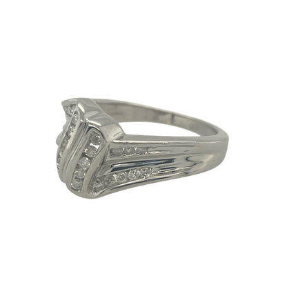 Add modern elegance and striking sparkle to your jewellery collection with this pre-owned 9ct white gold diamond twist ring, featuring a bold and contemporary design—perfect for special occasions or making a statement in everyday wear.

Design: The ring features an eye-catching twist design set with sparkling diamonds, creating a flowing and dynamic look. The front of the ring measures approximately 10mm in height, giving it a strong and noticeable presence on the hand.