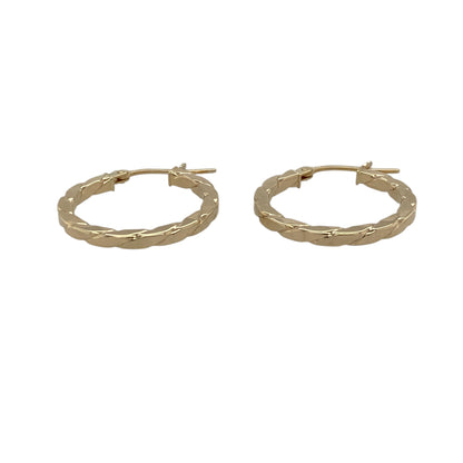 Add a modern twist to your jewellery collection with these pre-owned 9ct yellow gold squared twisted hoop creole earrings, combining classic hoop styling with a contemporary edge—perfect for everyday wear or elevating your look.

Design: The earrings feature a distinctive squared hoop shape with a twisted design, creating a unique blend of sharp structure and flowing texture for added visual interest.