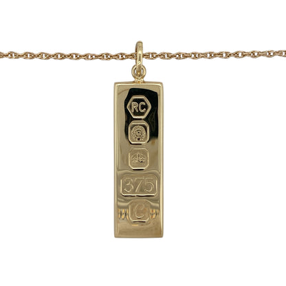Make a bold and timeless statement with this pre-owned 9ct yellow gold solid ingot pendant on a 24" Prince of Wales chain necklace, combining classic design with substantial presence—perfect for everyday wear or standout styling.

Design: The necklace features a traditional solid gold ingot pendant suspended from a Prince of Wales chain, creating a strong and iconic look.
Material: Made from 9-carat yellow gold, both the pendant and chain have a polished finish that enhances their rich, warm tone.